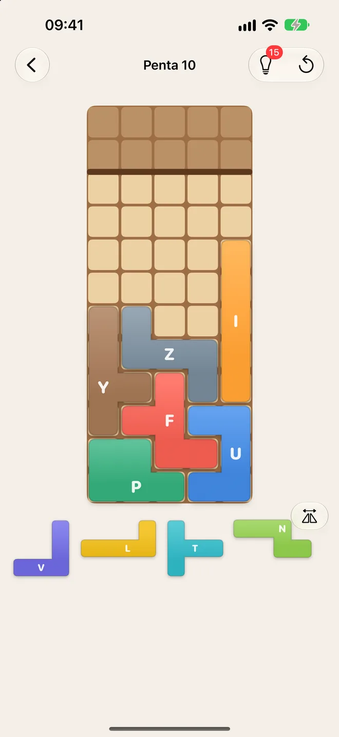 Katamino game screen: Penta 10 half filled with the P, U, F, Y, Z and I pieces, and the V, L, T and N pieces waiting in the tray below.